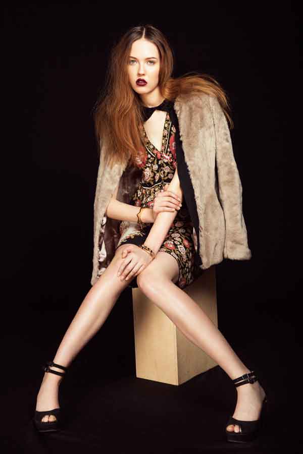 Anna Wong Stylist. Seattle wardrobe stylist.Seattle editorial stylist,Seattle commercial stylist,woman seated wearing Sportmax dress and taupe faux fur, Editorial Astound magazine.