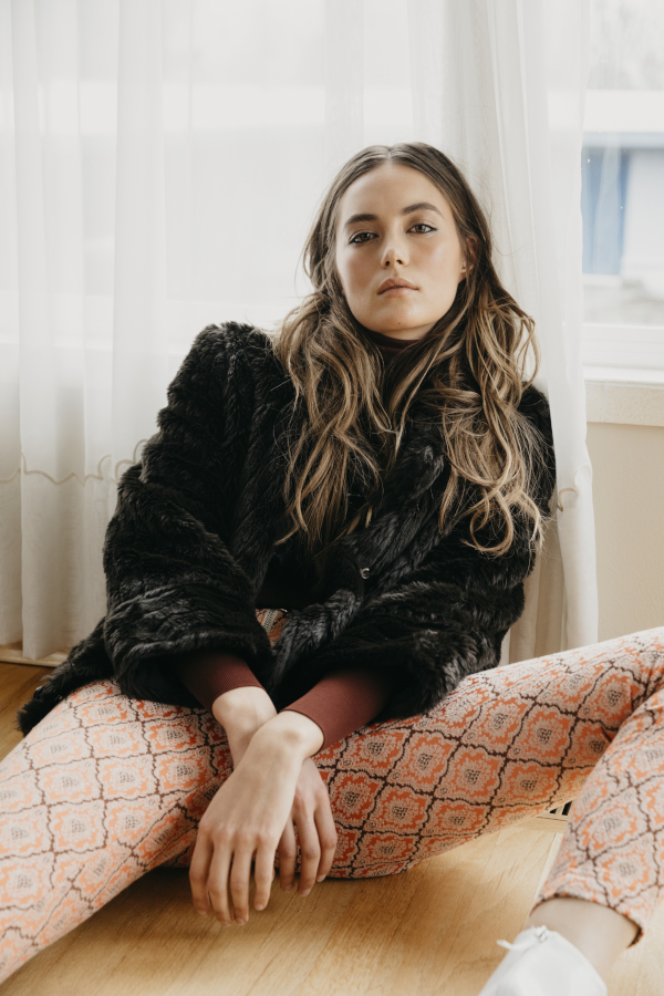 Anna Wong Stylist. Seattle wardrobe stylist,Seattle editorial stylist,Seattle commercial stylist,woman seated in Marc Jacobs faux fur jacket. 